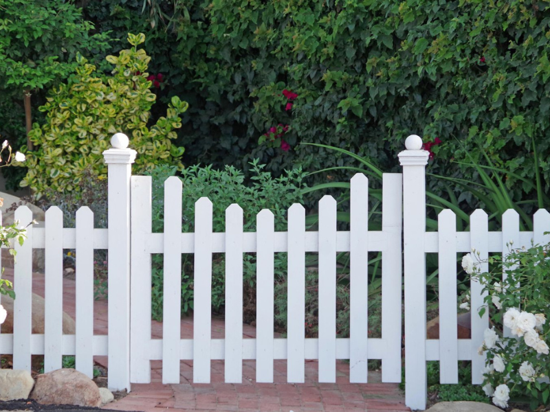 white fence in garden