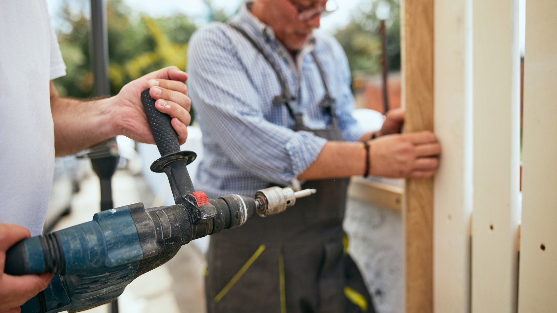 man installing fence